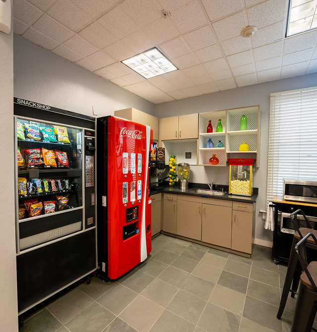 Communal kitchen with vending machines and popcorn machine